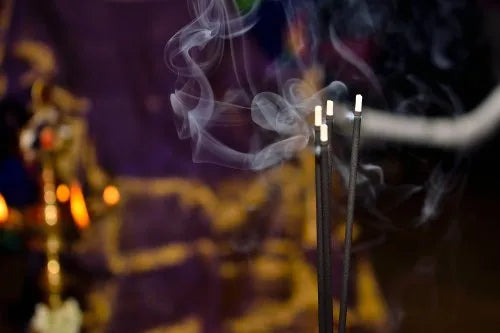 Group of Dark Incense Sticks Burning