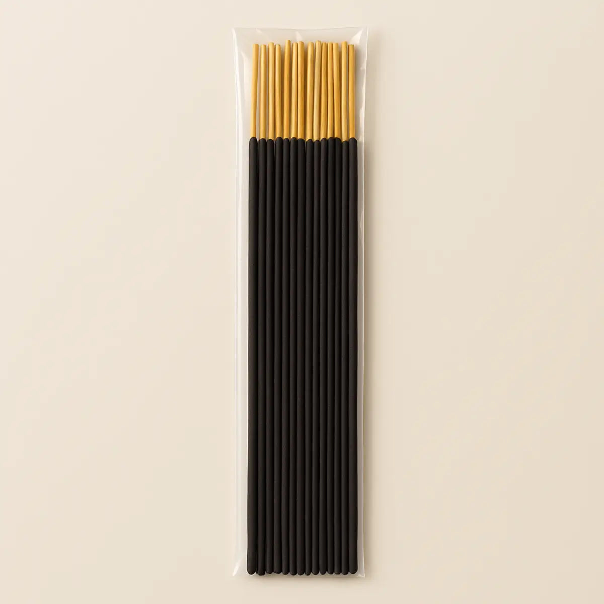 Bundle of 40 black incense sticks with golden tips, sealed in a clear plastic bag on a neutral background.